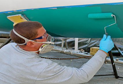 guy painting boat