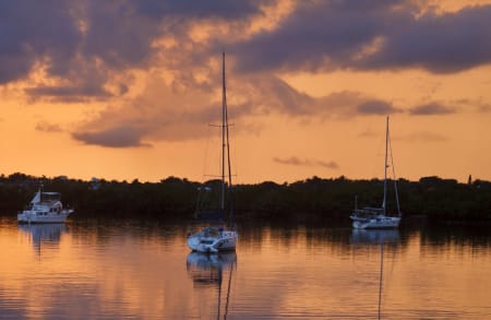 3 Boats Peacefully Anchored at Sunset
