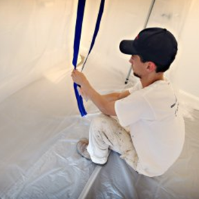 in use of Trimaco E-Z Up Peel + Stick Plastic Sheeting Zipper