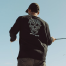 in use of Grundens Bait Ball LS Tech Tee
