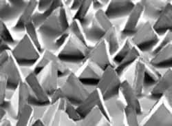 Detailed view of 3M Cubitron II precision-shaped ceramic grain
