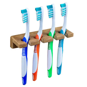 in use of Whitecap Industries Teak Toothbrush Holder