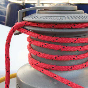 Close-up of a premium Samson braided running rigging sheet line wrapped securely around a sailboat winch.