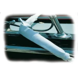 Removable black chafe guard protecting a white nylon dock line from abrasion against boat edges.