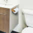 in use of Whitecap Industries Teak Toilet Tissue Rack